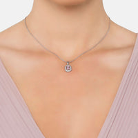 Silver pendant necklace with small round halo and pink gemstone centerpiece