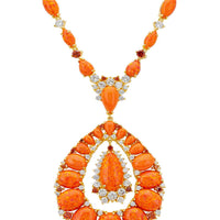 Gold-tone statement necklace with orange teardrop cabochon and crystal halo accents