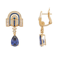 Gold art deco drop earrings with blue sapphire teardrop, side view