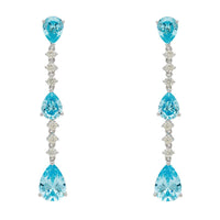 Silver drop earrings with blue topaz pear stones and crystal accents