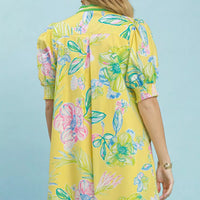 Back view of lemon botanical print dress with short puff sleeves and smocked cuffs