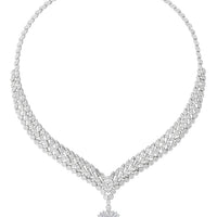 Silver tennis-style statement necklace with emerald pendant and clustered heart-shaped clasp