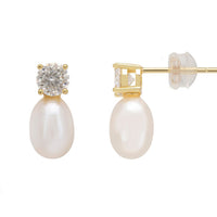Gold earrings: round moissanite stud with white pearl drop and butterfly backing