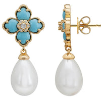Gold flower clover drop earrings shown from the back with butterfly clasp
