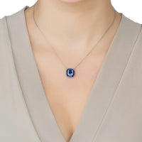 Sapphire pendant necklace with small blue square charm on silver chain