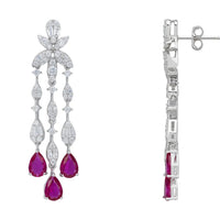 Silver drop earrings with purple teardrop stones, shown from side with post backing