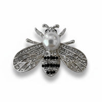 Silver-tone bee brooch with faux pearl body and detailed rhinestone wings