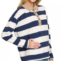 Navy and white striped polo shirt with contrast collar, button front, and long sleeves