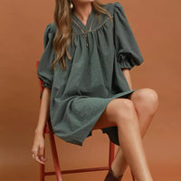Stone-blue textured mini dress with puff sleeves and V-neck, short hem