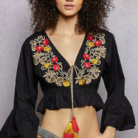 Black cropped blouse with floral embroidery at V-neck and puff sleeves