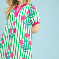 Green striped floral dress with pink collar and trim, short puff sleeves