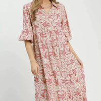 Tiered midi dress with pink botanical print, three-quarter length look, and ruffled tiers