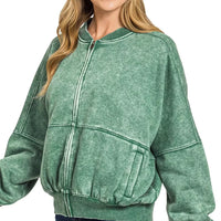 Dark green acid-washed fleece jacket with zip collar and ribbed cuffs