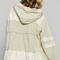 Beige hooded jacket with raw hem; back panel seams and gathered tier details