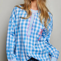 Blue gingham embroidered palm tree blouse with pink trim and long puff sleeves