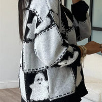 Black/white ghost patchwork checkered sweater with long sleeves and ribbed bottom