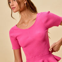 Hot pink ribbed knit peplum sweater top, short sleeves, fitted waist and peplum