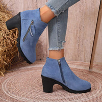 Blue suede block-heel ankle boots with round toe and side zipper closure