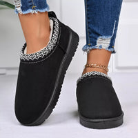 Black platform ankle boots with patterned trim and low block platform sole