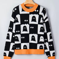 Ghost checkerboard sweater, black and white knit with orange ribbed crew neck