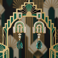 Art Deco chandelier earrings with emerald-green teardrop drops and gold geometric frames