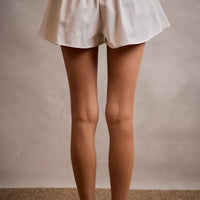 White denim skort with smocked waistband and A-line bubble hem