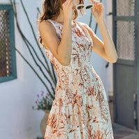 Smocked fit-and-flare mini dress with coral and white shell print, sleeveless round neck