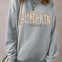 Gray oversized pullover sweatshirt with “PUMPKIN SEASON” graphic on back