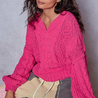 Fuchsia cable-knit V-neck cropped sweater with long sleeves
