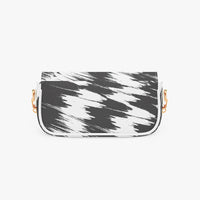 Black and white brush-pattern crossbody bag with curved flap and gold chain