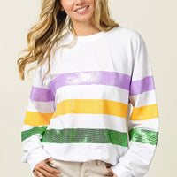 White pullover sweatshirt with sequin purple, yellow, and green horizontal stripes