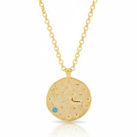Gold zodiac talisman necklace with round pendant and blue birthstone accents