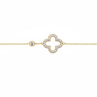 Gold bracelet with open clover charm and small round accents