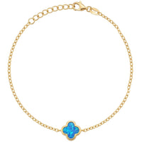 Gold chain bracelet with blue four-leaf clover charm and small clasp