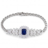 Silver gemstone bracelet with blue sapphire center and leaf motif