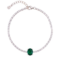 Silver tennis bracelet with emerald green oval center gemstone and white stones