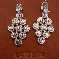 Silver cascading disc drop earrings with perforated circular links