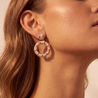 Gold drop earrings with pavΓ© hoop and crystal stud