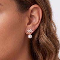 Rose gold flower stud earrings with small white pearl drops