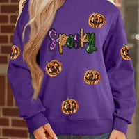 Violet sequin Halloween sweatshirt with 'Spooky' and pumpkin sequin pattern
