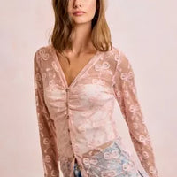 Dusty rose V-neck button mesh cardigan with bow-pattern print and long sleeves, worn open