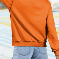 Orange mock neck sweatshirt back view with curved hem and ribbed cuffs