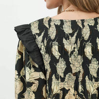 Black-and-cream floral smocked yoke with gathered ruffle sleeve detail