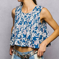 Navy floral sleeveless cropped tank with round neckline and pintuck pleats