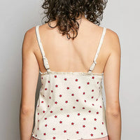 Back view: star-print ribbed knit cami, natural with red stars, thin spaghetti straps