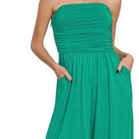 Green strapless tube jumpsuit with ruched bodice and gathered tiered skirt