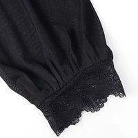 Black sheer sleeve cuff with lace trim on a velvet blouse