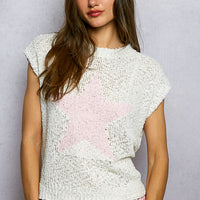 Ivory popcorn knit top with round neck and cap sleeves, pink star pattern