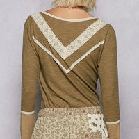 Olive ribbed knit top with white V-trim at back yoke and long sleeves