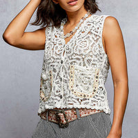 Off-white crocheted cropped button-down vest, sleeveless, with front buttons and scalloped hem